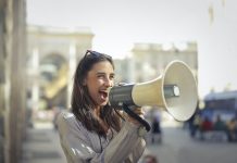 Harnessing the Power of Influencer Marketing in Pharma woman with megaphone