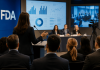 Advisory Committees as Brand Moments: Preparing for Public Scientific Scrutiny Pharmaceutical executives presenting clinical data during a high-profile FDA advisory committee meeting with media and healthcare stakeholders present.