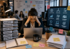 The Impossible Job: Why Pharma Brand Managers Are Being Asked to Do Too Much Overwhelmed pharmaceutical brand manager managing AI tools, compliance workflows, omnichannel campaigns, and cross-functional collaboration in a modern office.
