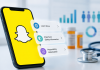 Snapchat Just Made Pharma Ads Easier to Run. Will Brand Teams Actually Use It? Smartphone displaying Snapchat with multiple pharmaceutical advertising CTAs for safety and prescribing information.