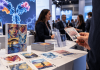 Why Is Patient Art Sitting at an ADC Conference? Invenra Thinks B2B Marketing Needs More Humanity. Patient-inspired artwork displayed on playing cards at a biotechnology conference, illustrating Invenra's human-centered approach to B2B life sciences marketing.