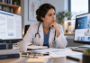 Doctors Trust the Journal. They Don’t Trust Your Content Nearly as Much. Female physician comparing peer-reviewed medical research with pharmaceutical marketing content on two monitors, highlighting the importance of scientific evidence and trust.